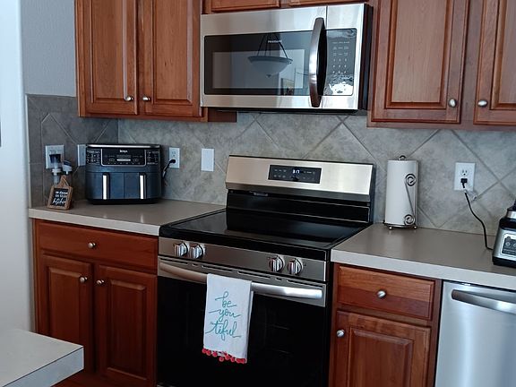 Kitchen with stainless steel appliances.