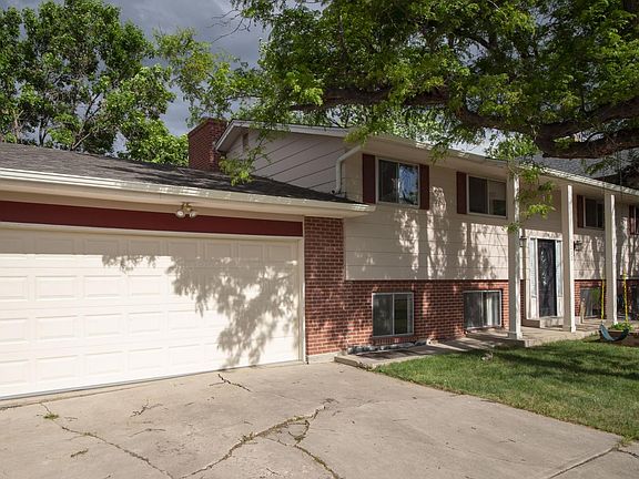 Room for 3 cars in driveway, spacious garage for 1 car and ample storage space.