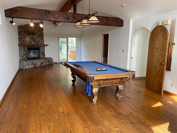 Family room upstairs, pool table, gas fireplace, half bath