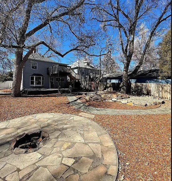 Large backyard with built-in firepit