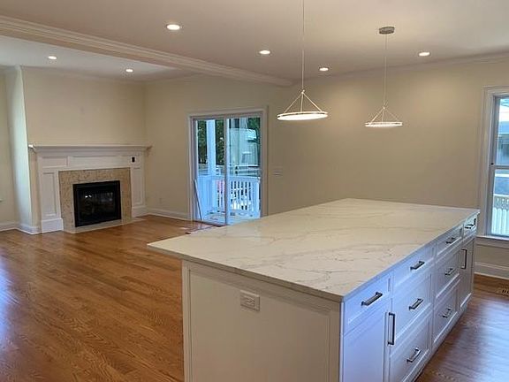 Kitchen to Family Room Views ; Cozy Fireplace