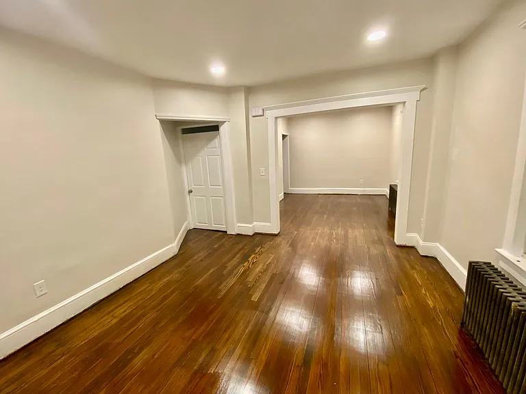 dining room leading to living room and door to the basement
12x13