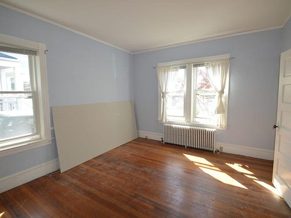 The Master Bedroom is bright and airy with double doors and hardwood floors