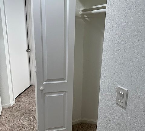 Second coat closet provides additional storage.