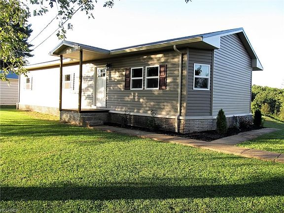 Sits on right under 1/2 acre lot with exterior updates featuring new roof, new gutters, all new windows and siding