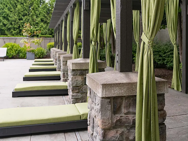 Apartment community resort style pool + cabanas at Griffis North Creek in Bothell, Washington.