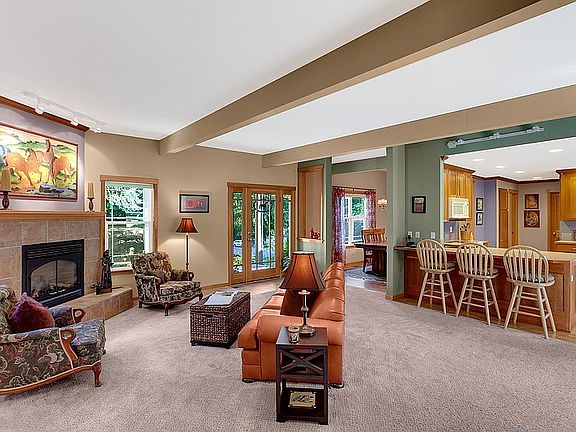 Open floor and flexible floor plan. Beamed ceilings highlight the LR w/ gas run fireplace.