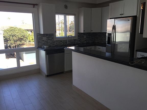 Beautiful ocean view dining area with breakfast bar off of gourmet kitchen.