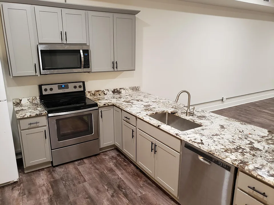Kitchen with new cabinets and real granite tops.