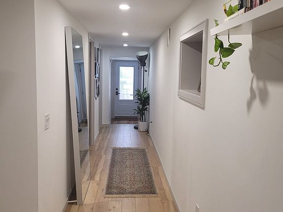 Hallway leading to main front door private entrance