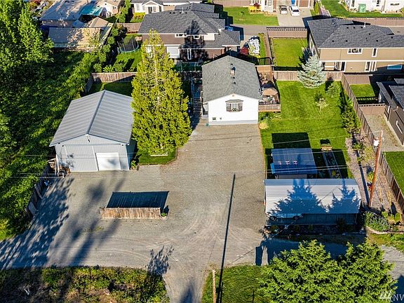 Lots of parking and space to turn around.  Covered parking canopy (lower right) is included in the sale.