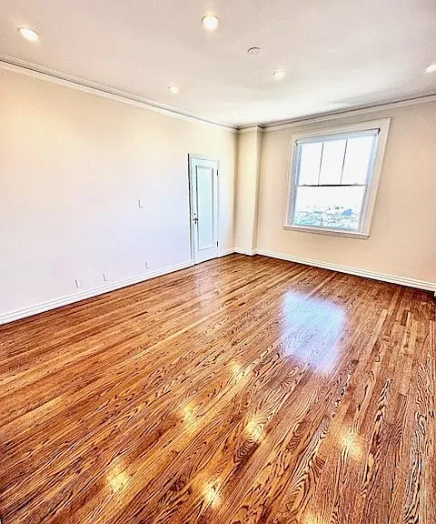 Unit #504 enormous primary bedroom with JAW DROPPING BAY VIEWS and recessed can lighting!