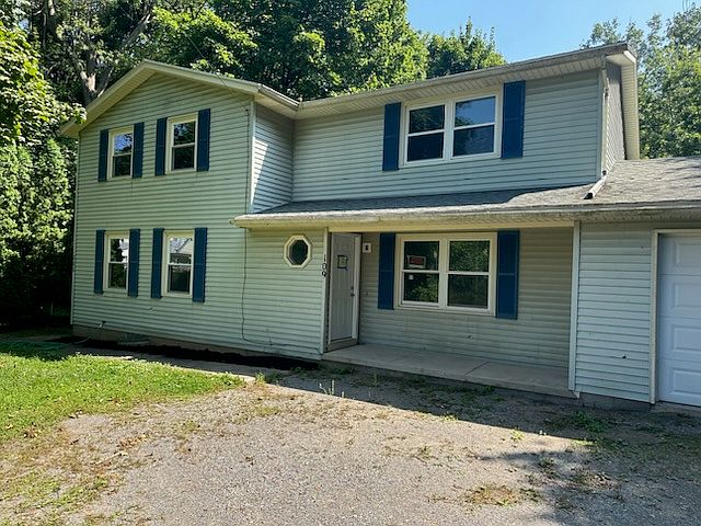 Vinyl Sided Two-Family. New Everything! Kitchen. Windows. Flooring. Remodeled Bathroom. New Carpeting. Deck/Balcony Overlooks Stream. Basement. One Car Garage Detached. Fresh & New.