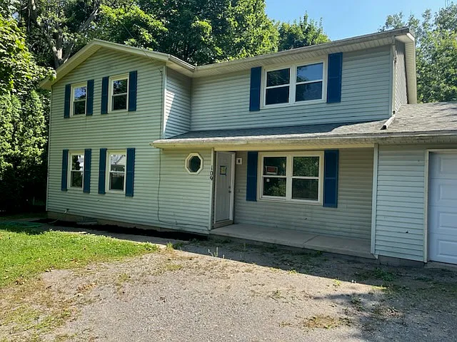 Vinyl Sided Two-Family. New Everything! Kitchen. Windows. Flooring. Remodeled Bathroom. New Carpeting. Deck/Balcony Overlooks Stream. Basement. One Car Garage Detached. Fresh & New.