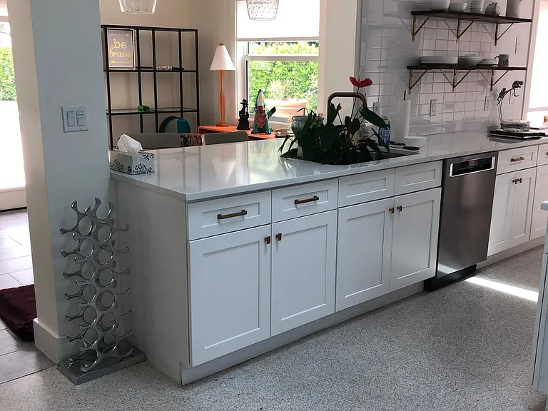 Kitchen with original terrazzo floors and breakfast/bar counter.