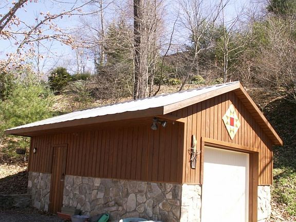 One car garage and side man door. There is a garage door opener included.