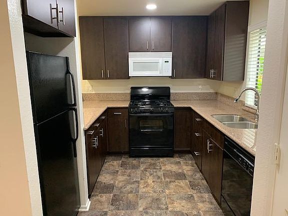 Updated kitchen with refrigerator, stove, microwave, dishwasher and garbage disposal.