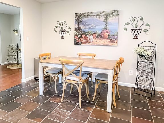 The eat-in kitchen has a dining table that can be set for 4 to 6 people