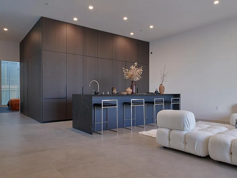 Expansive Chef's Kitchen with Luxe Detailing _ Featuring a stunning marble island, Miele appliances, and integrated LED lighting, this kitchen is designed for both function and beauty.