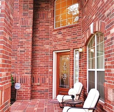 Covered two story front porch is great for entertaining with neighbors.