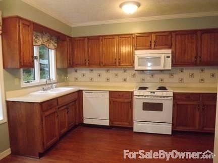 Kitchen
						:
						The eat-in kitchen has hardwood floors and tons of natural light.
