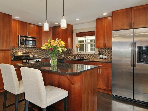 Kitchen with stainless appliances and wine cooler