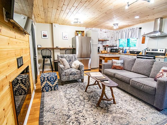 Cozy downstairs living area with smart TV