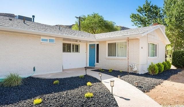 Front Door painted flat modern black. Landscaping in progress.