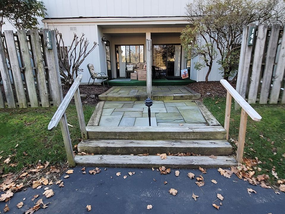 Front entrance and upper level balcony.