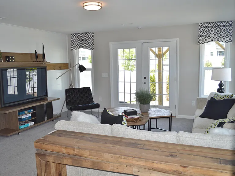French doors lead to the patio area and a nicely landscaped fully-fenced backyard.