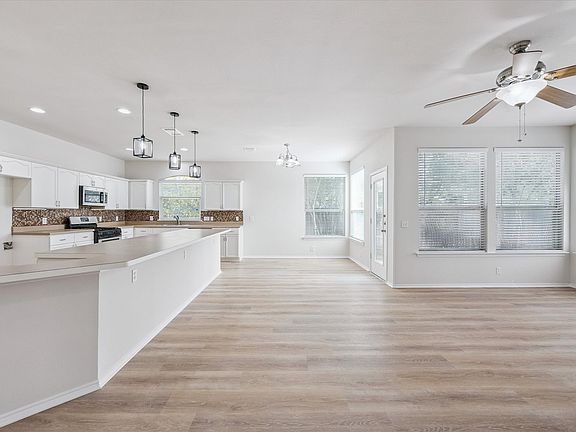 Family room is open to the kitchen with expansive island.