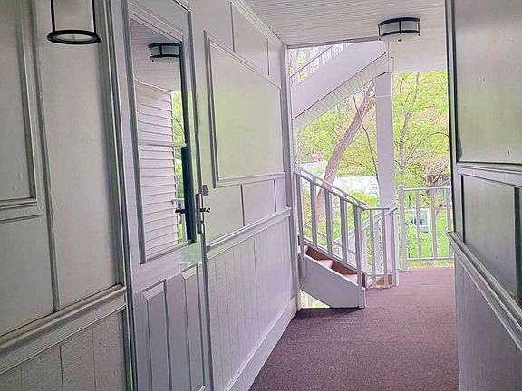 Welcoming covered walkway entrance adding charm and convenience to everyday condo living.