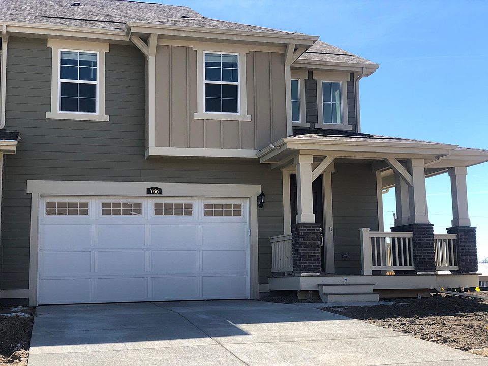 2 car garage, with front and side porch