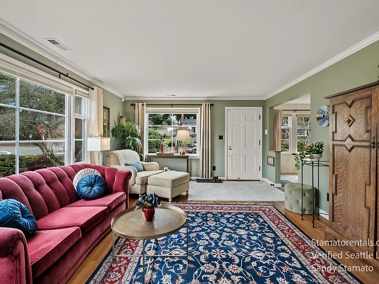 The armoire discreetly conceals the Samsung Smart TV and electronics, keeping the living room uncluttered and inviting.