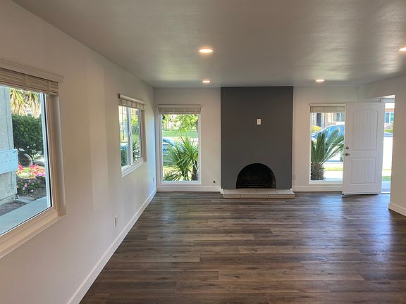 Livingroom with gas fireplace and space for wall mount TV.