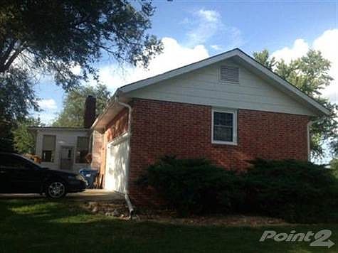 A side view of the garage and sun porch.