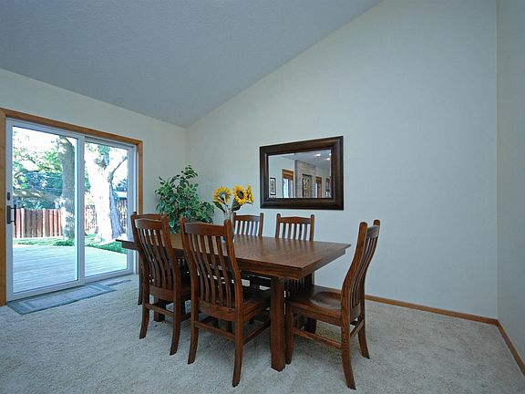 Glass door in dining room leads to big deck