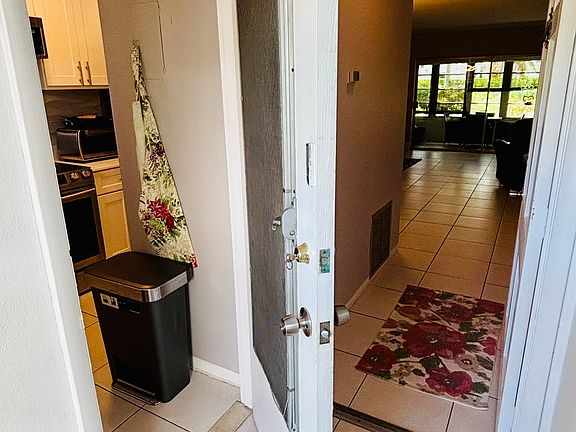 Split entrance doors; 1 into front entrance; 2nd into kitchen.