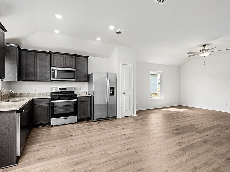 The family room sits right off of the kitchen, so you are always a part of the fun.