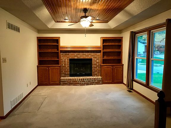 Living Area with Brick Fireplace & Gas Insert