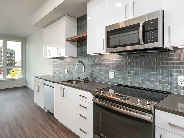 Kitchen with Quartz Countertops and Stainless Steel Appliances