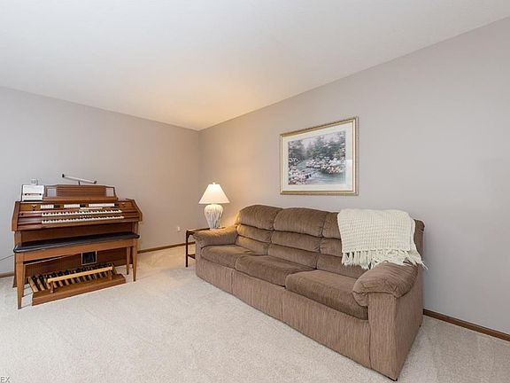 Living room with new carpet located off the foyer.