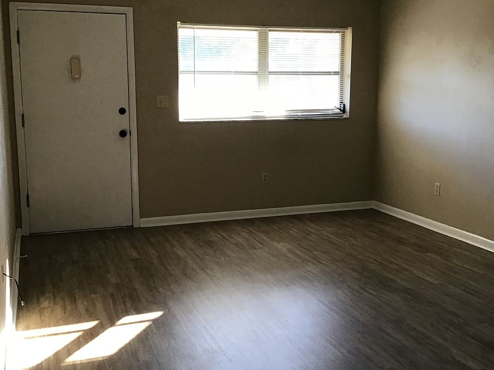 Living room with door to balcony.