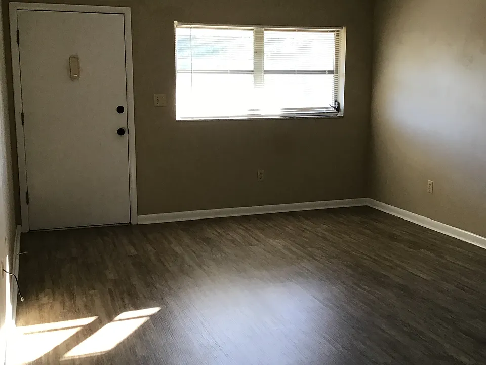 Living room with door to balcony.