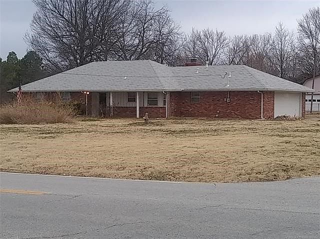 Front Elevation. Covered front porch. Facing 81st St South. Entrance on right side from Yukon.