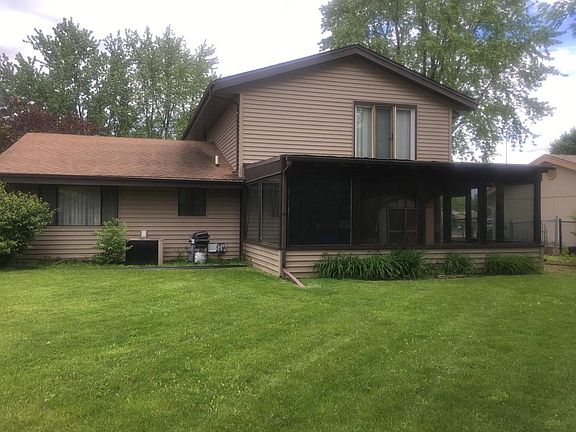 Back of house with sunroom addition