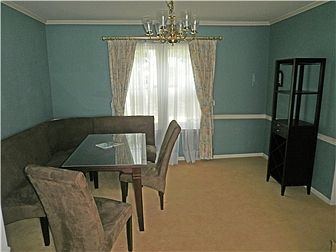 Dining room w/chair rail crown molding, open to LR
