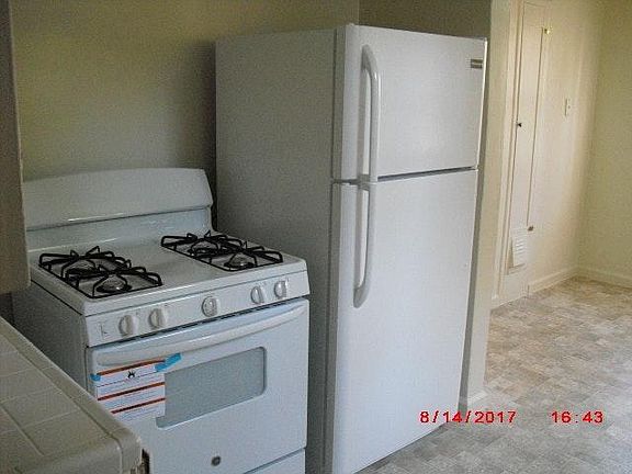 New gas stove and refrigerator in Kitchen