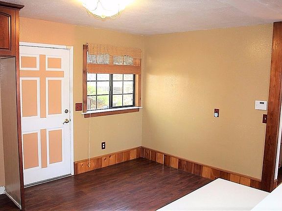 Dining Area in the kitchen with Decorative Wood Vertical Grain Redwood.