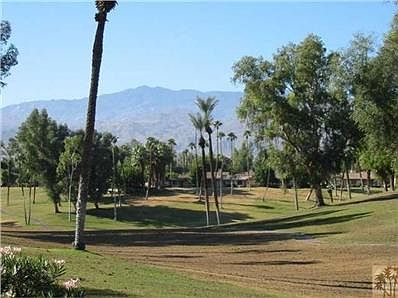 3BR/2BA condo enjoys panoramic course and mountain views.